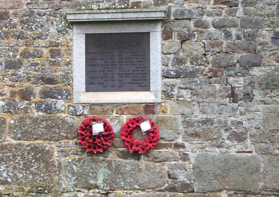 Original War Memorial on wall of Church Rooms showing 2 wreaths.