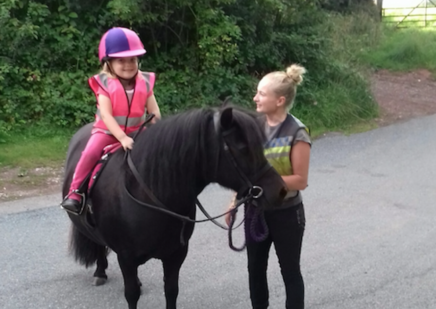 Annie Matravers leading Elsie aged 5 on a pony ride