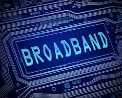 Image of the word Broadband in blue surrounded by wires and tracks