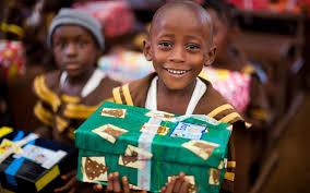 Child holding a Christmas present