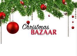 Image of fir tree branches with red baubles hanging and Christmas Bazaar written across