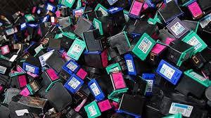 Photos of a pile of empty printer cartridges