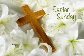 Picture of a wooden cross lying in white fabric with Easter Sunday written in the corner