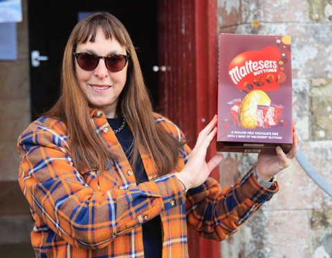 Veronica holding her egg up in triumph