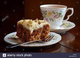 Picture of a slice of cake and a cup of tea.