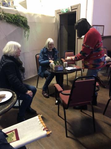 Photo of ladies in the village hall crafting