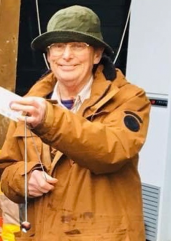 Photo of Charlie holding a conker
