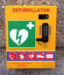 A defibrillator attached to a wall
