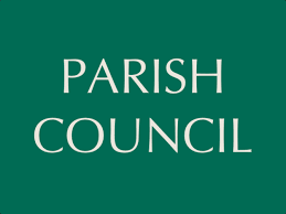 A green sign with Parish Council written in white letters