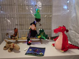 Knitted animals on display in a Christmas scene