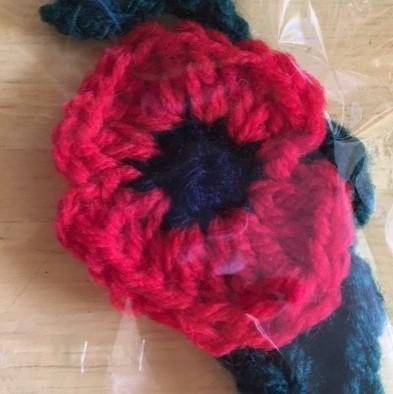 Knitted red poppy