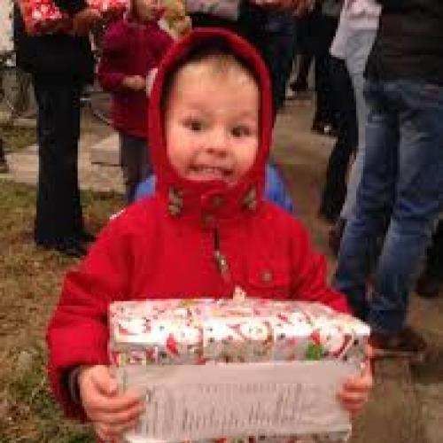 Child holding a christmas parcel