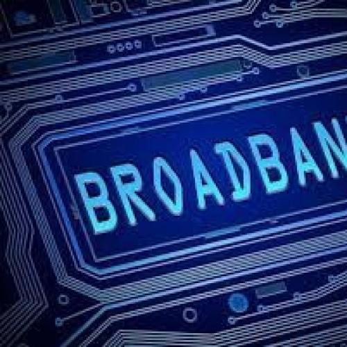Image of the word Broadband in blue surrounded by wires and tracks