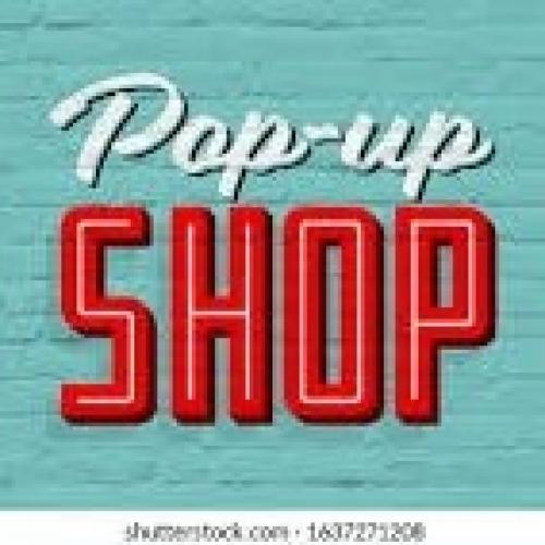 Red and white writing on a blue background saying 'Popup Shop'