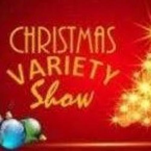 The words Christmas Variety Show written on a red background with a christmas tree and baubles