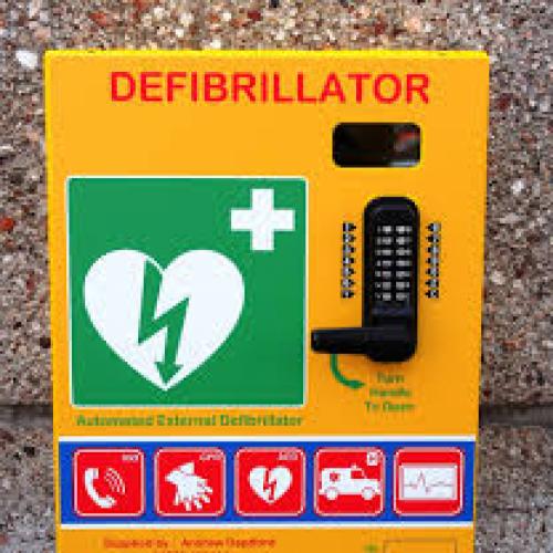A defibrillator attached to a wall