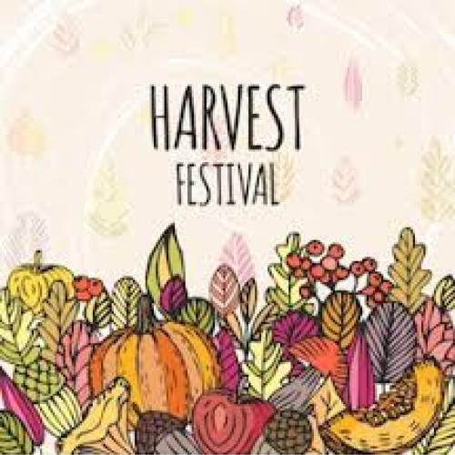 Clip art of lots of fruit and veg with Harvest Festival written above