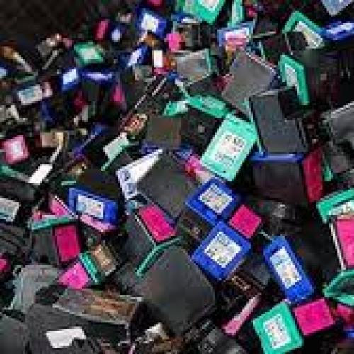 Photos of a pile of empty printer cartridges